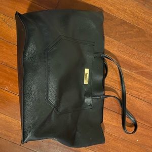 Black faux leather handbag with floral lining